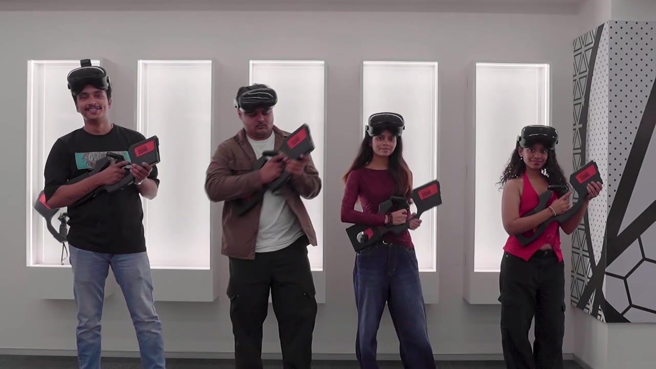 A corporate group geared up with headsets and haptic controllers