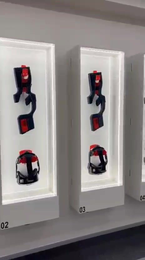 Wall-mounted VR headsets and haptic controllers on display