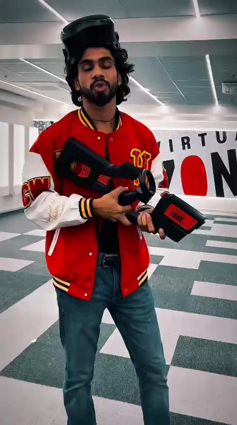 Visitor smiling while holding VR motion controllers